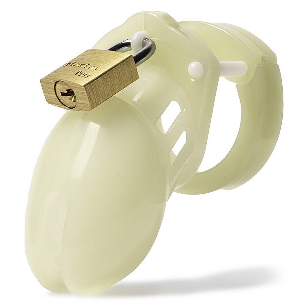 Glow-in-the-dark chastity cage shown glowing green in the dark - BDSM Authority