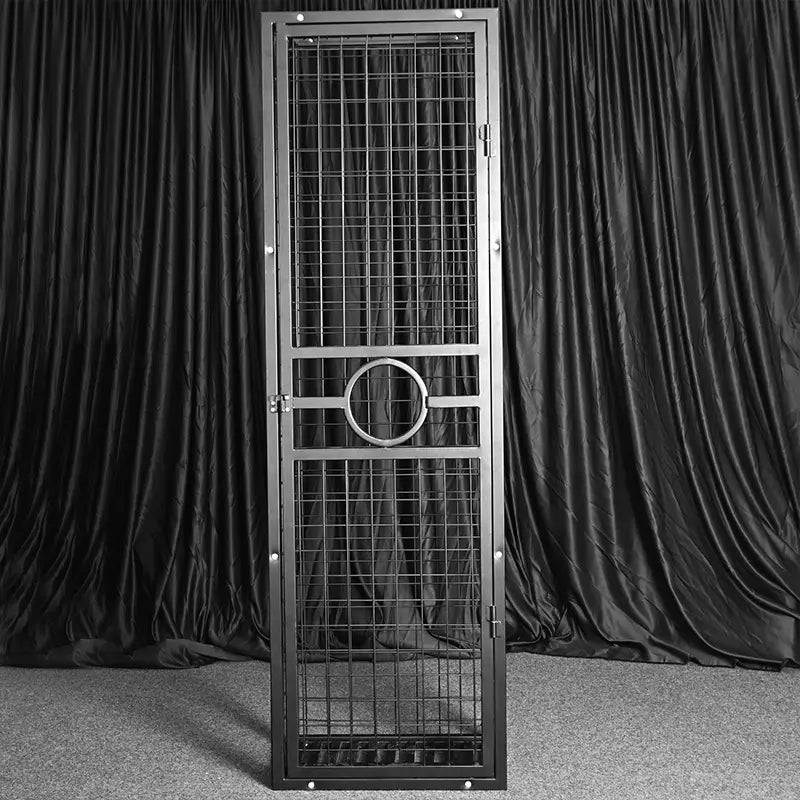 Heavy-duty standing BDSM cage side view with reinforced vertical frame and cross-bracing, BDSM Authority