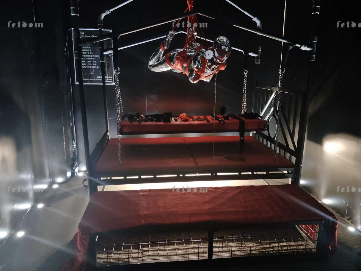 Sleeping and standing confinement cage wide angle showing full-length steel enclosure - BDSM Authority