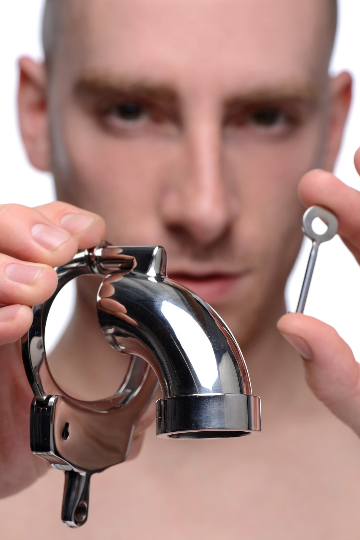 Illustration of the CockCuff chastity device shown fitted on a male model - BDSM Authority
