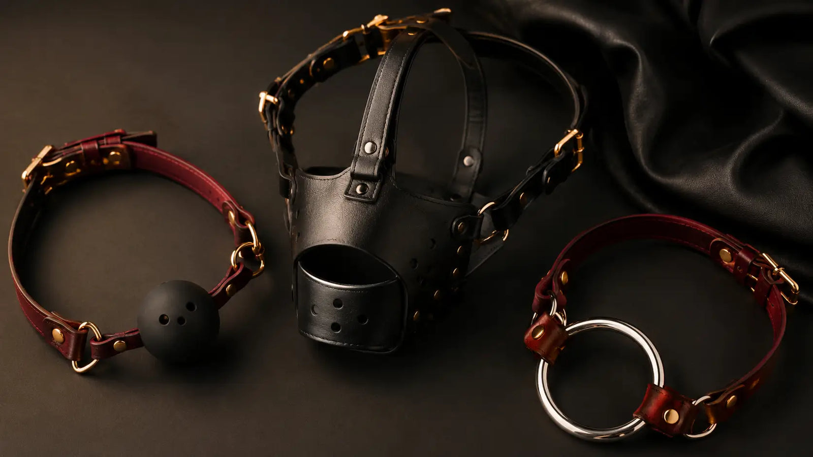 Premium leather muzzles and gags flat lay BDSMAuthority