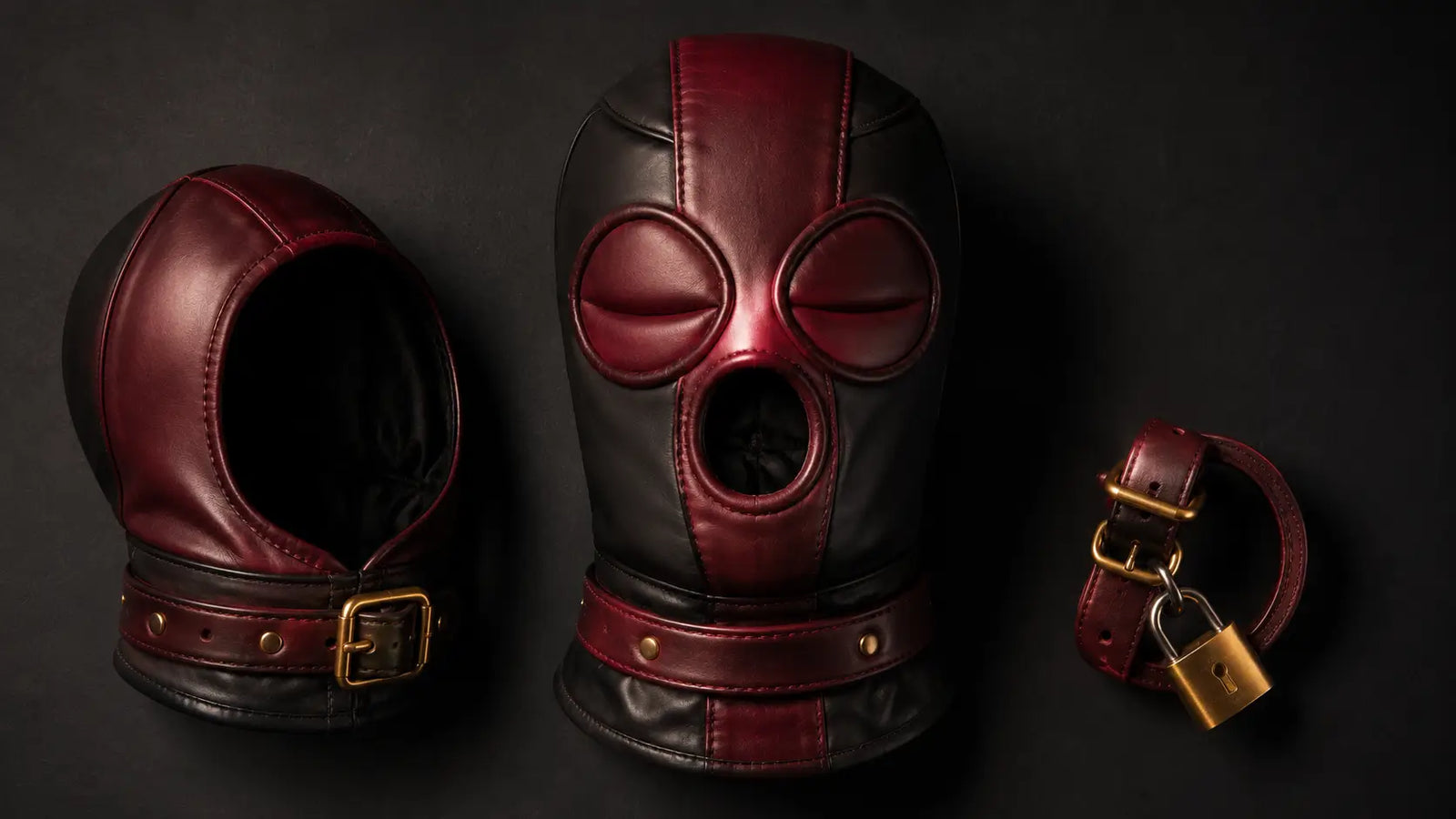 Premium leather sensory deprivation hoods flat lay BDSMAuthority