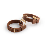 Crave ICON Cuffs tan leather cuffs with 24kt gold finish hardware - BDSM Authority