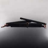 Coquette Pleasure spreader bar showing the adjustable sliding length mechanism - BDSM Authority