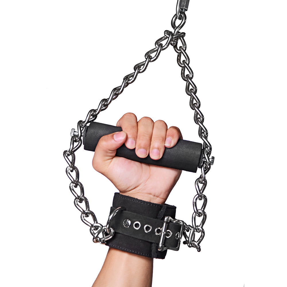 Hand gripping the foam handle on the Strict Leather suspension cuff - BDSM Authority