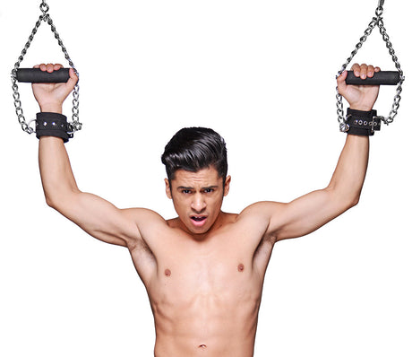 Strict Leather suspension cuffs shown in use - BDSM Authority