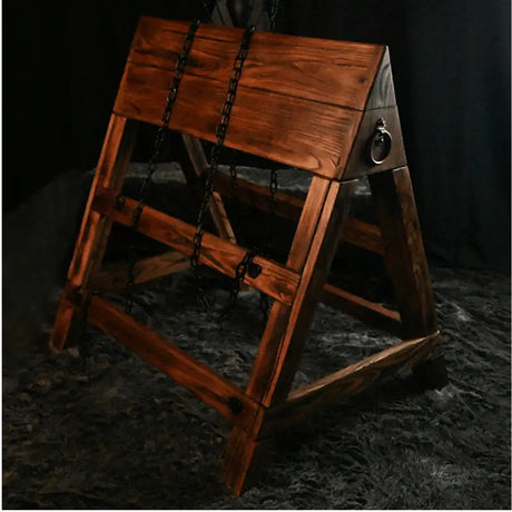 Adjustable kneeling and prone triangular wooden horse HQSM-018 side view with chain featuring durable wooden frame, ergonomic angled support, and adjustable restraint system for specialized training or therapy use
