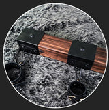 Elm wood spreader bar shown with two cuffs along the carbonized elm bar - BDSM Authority