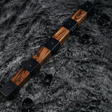 Elm wood spreader bar shown with four cuffs along the carbonized elm bar for multi-point restraint - BDSM Authority