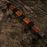 Elm wood spreader bar point-of-view angle showing cuffs and steel hardware for positioning - BDSM Authority