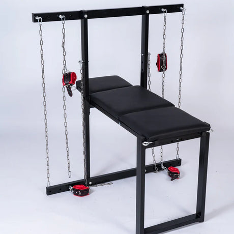 Exhibition bench with restraints and shackles fitted for a secure hold - BDSM Authority