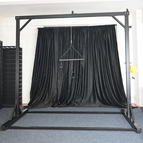 Reinforced steel suspension frame with center hook and chain rigging detail - BDSM Authority