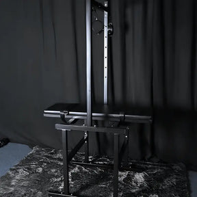 Heavy-duty leg-lift bondage frame with reinforced steel construction and adjustable support system
