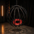 Heavy-duty pumpkin cage with reinforced steel construction and enclosed restraint design
