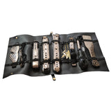 The Traveler bondage kit cuffs collar nipple clamps ball gag laid out at BDSM Authority