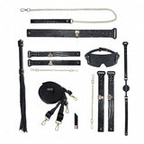 Ouch! International Rome Collection 8-Piece Bondage Kit with Iridescent Handbag, Collar, Cuffs, Flogger and Vibrating Bullet