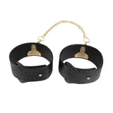 Ouch! International Rome Collection 8-Piece Bondage Kit with Iridescent Handbag, Collar, Cuffs, Flogger and Vibrating Bullet