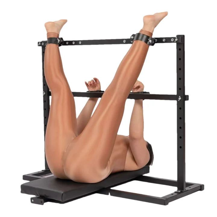 Portable Adjustable Restraint Bench with model, heavy-duty adjustable BDSM furniture featuring reinforced portable frame, padded supports, and secure positioning system shown in use for stable support and control.
