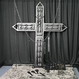 Luxury St. Andrew’s cross with padded black upholstery, restraint chains, cuffs, and premium BDSM accessories displayed in a professional dungeon-style setup. High-end BDSM furniture designed for upscale private playrooms, commercial studios, and luxury dungeon installations.