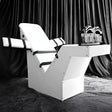 Premium Fun Chair White HQTK-010 white padded luxury chair with black straps in a dark studio setting.