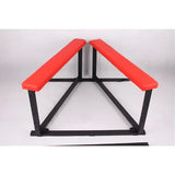 Red cushion spanking bench spread feature showing adjustable positioning and extended support design