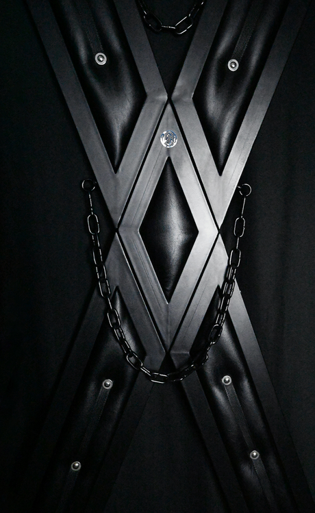 Elegant Noir St. Andrew's cross angled view showing X-frame and matte black finish - BDSM Authority