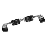 Angled view of the spreader bar showing the swiveling pivoting end cuffs and locking rings - BDSM Authority