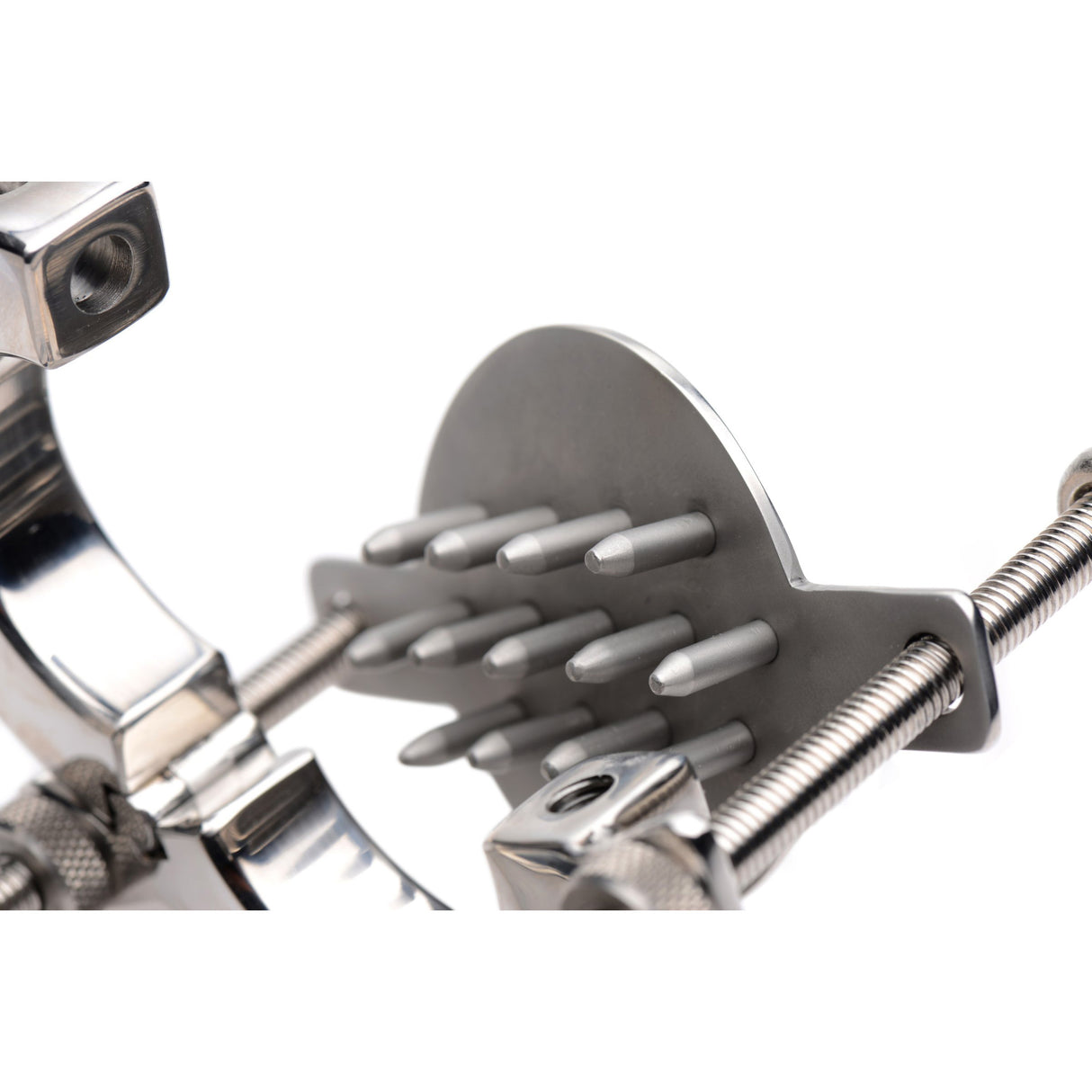 Close-up of the ball stretcher rings and the raised plate of sharp spike points - BDSM Authority