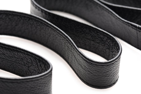 Adjustable leather strap and D-ring hardware of the bed restraint kit - BDSM Authority