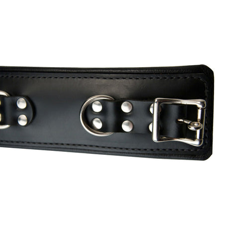 Close detail of the triple-layer padded leather ankle cuff - BDSM Authority
